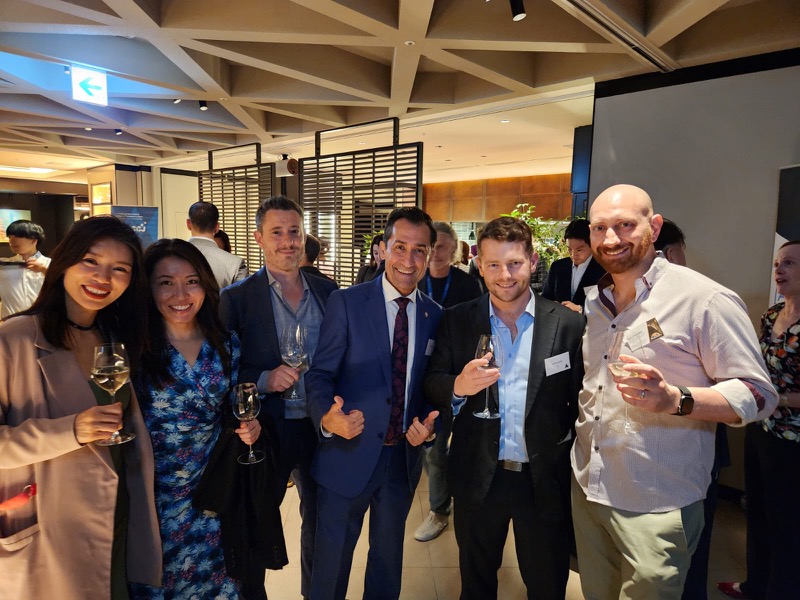 Members at an ANZCCJ committee event, glasses in hand