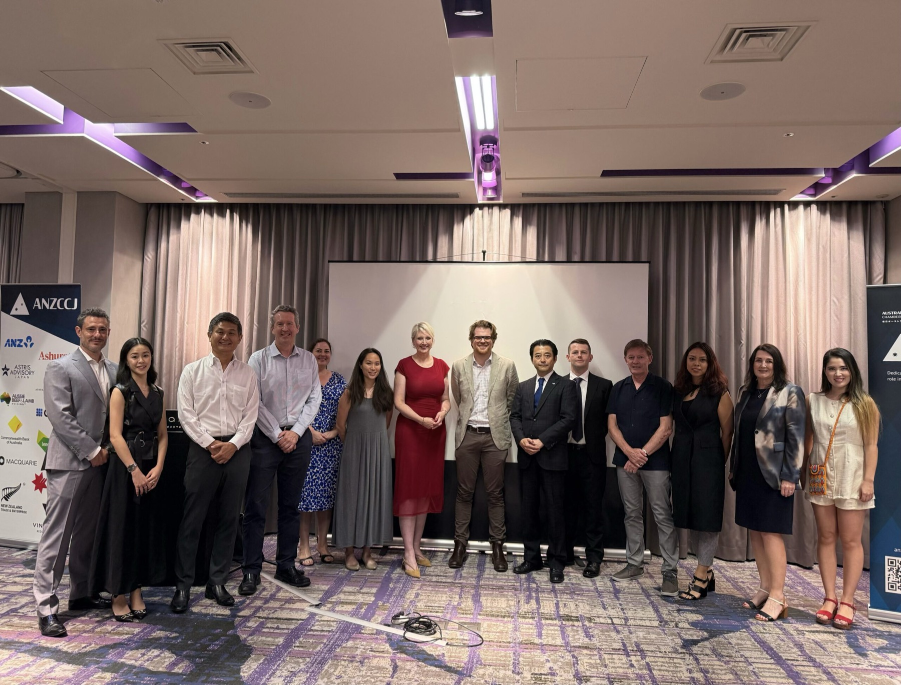 A group of ANZCCJ members and guests photographed together at a chamber event